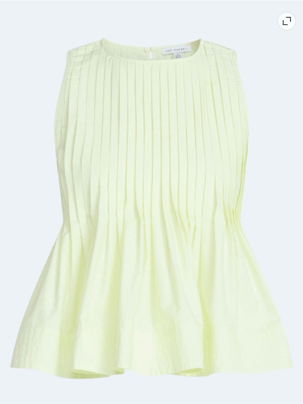 Sleeveless Pleated Peplum Blouse in Pale Yellow